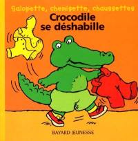 Crocodile se déshabille : salopette, chemisette, chaussettes